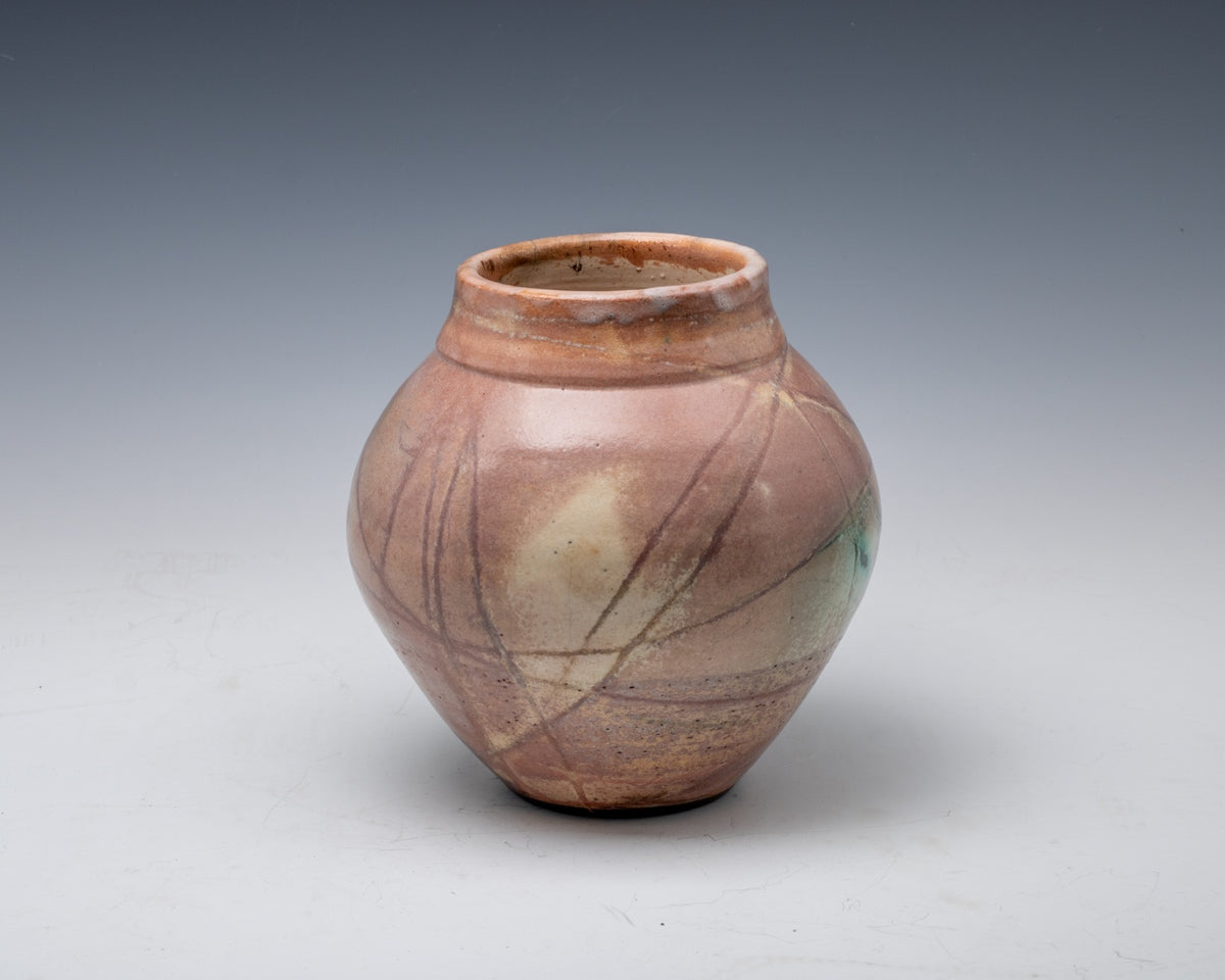 Ferric chloride fumed white stoneware vessel with hemp-resist markings, second view