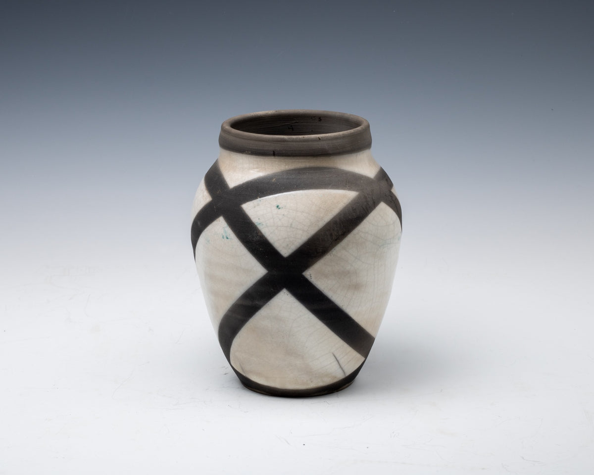 Geometric white crackle raku vessel with bold black linear design, fourth view